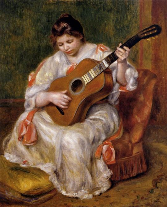 Женщина, играющая на гитаре  